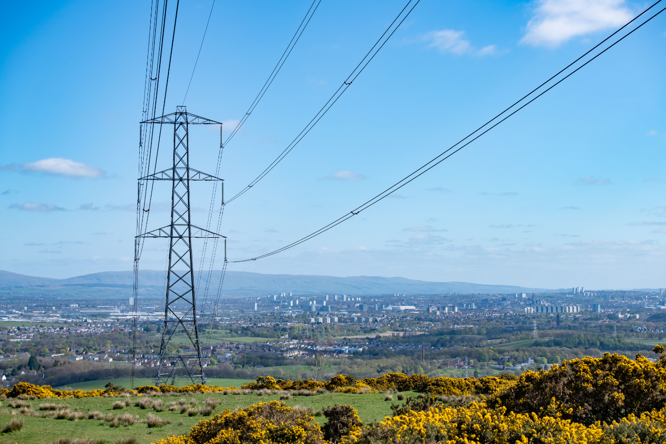 View of a transmission tower and Glasgow cityscape